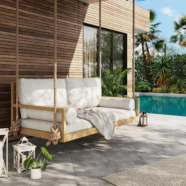 The Savannah Swing Bed next to a backyard pool